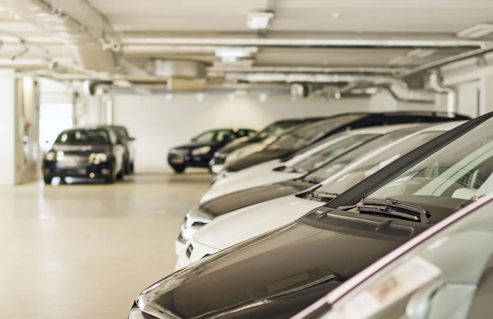 Cars parked inside an indoor vehicle storage facility