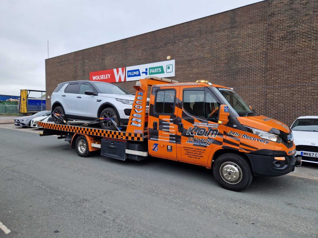 K.O.M transporter collecting a car
