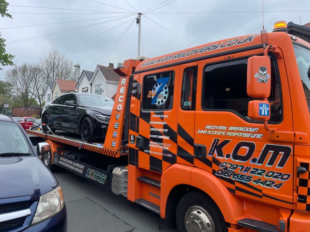 A vehicle loaded on the K.O.M flatbed