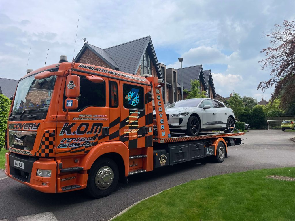 Vehicle safely loaded onto a K.O.M recovery truck